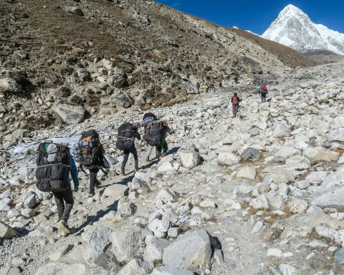 Porter Carrying Load On Way To Everest Base Camp 